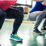 A woman and man squatting. Doing great exercise for immunity!